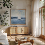 Sailboats I by Chris Paschke. Shown in a natural wood frame in a cozy modern living room. Available as an archival giclee rolled canvas, fine art paper, or poster print. SKU 73874a.