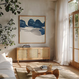 Sapphire and Gray II by Chris Paschke. Shown in a natural wood frame in a cozy modern living room. Available as an archival giclee rolled canvas, fine art paper, or poster print. SKU 34713a.