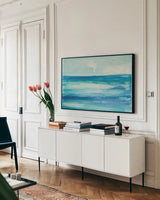 Seascape I by Chris Paschke. shown as a framed stretched canvas in a living room above a console. Available as a archival giclee rolled canvas, fine art paper, or poster print. SKU 15139i.