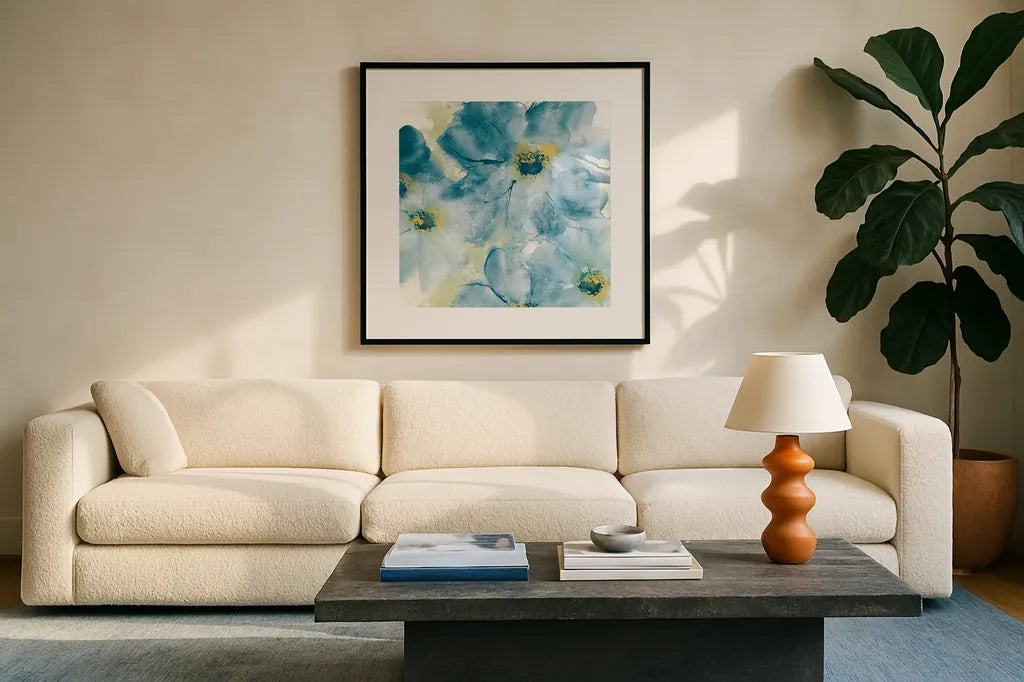 Seashell Cosmos I Blue and Yellow by Chris Paschke. Displayed in a glass frame with matte in a clean modern living room. Available as an archival giclee rolled canvas, fine art paper, or poster print. SKU 31295a.