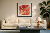 Seashell Cosmos I Red and Orange by Chris Paschke. Displayed in a glass frame with matte in a clean modern living room. Available as an archival giclee rolled canvas, fine art paper, or poster print. SKU 31299a.