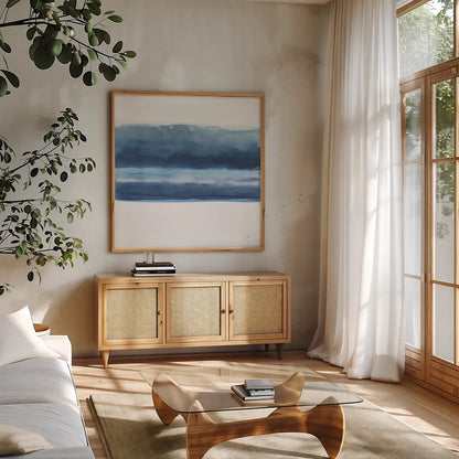 Serenity Sea V by Chris Paschke. Shown in a natural wood frame in a cozy modern living room. Available as an archival giclee rolled canvas, fine art paper, or poster print. SKU 85759a.