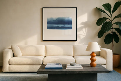 Serenity Sea VI by Chris Paschke. Displayed in a glass frame with matte in a clean modern living room. Available as an archival giclee rolled canvas, fine art paper, or poster print. SKU 85760a.