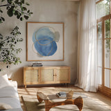 Serenity Trance I by Chris Paschke. Shown in a natural wood frame in a cozy modern living room. Available as an archival giclee rolled canvas, fine art paper, or poster print. SKU 85749a.