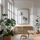 Shadow Palms II by Chris Paschke. shown as a print in a natural wood frame in a dining room. Available as a archival giclee rolled canvas, fine art paper, or poster print. SKU 78871h.