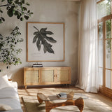 Silver Leaf Papay by Chris Paschke. Shown in a natural wood frame in a cozy modern living room. Available as an archival giclee rolled canvas, fine art paper, or poster print. SKU 36632a.