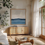 Silver Sea II by Chris Paschke. Shown in a natural wood frame in a cozy modern living room. Available as an archival giclee rolled canvas, fine art paper, or poster print. SKU 84581a.