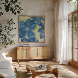 Starlight Clematis II by Chris Paschke. Shown in a natural wood frame in a cozy modern living room. Available as an archival giclee rolled canvas, fine art paper, or poster print. SKU 50156a.