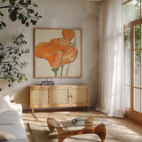 Sunshine Poppy IV by Chris Paschke. Shown in a natural wood frame in a cozy modern living room. Available as an archival giclee rolled canvas, fine art paper, or poster print. SKU 10761a.