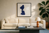 Swash I Indigo by Chris Paschke. Displayed in a glass frame with matte in a clean modern living room. Available as an archival giclee rolled canvas, fine art paper, or poster print. SKU 68772a.