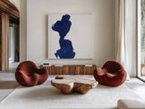 Swash I Indigo by Chris Paschke. Shown as extra-large giant wall art in a modern living room. Available as an archival giclee rolled canvas, fine art paper, or poster print. SKU 68772a.