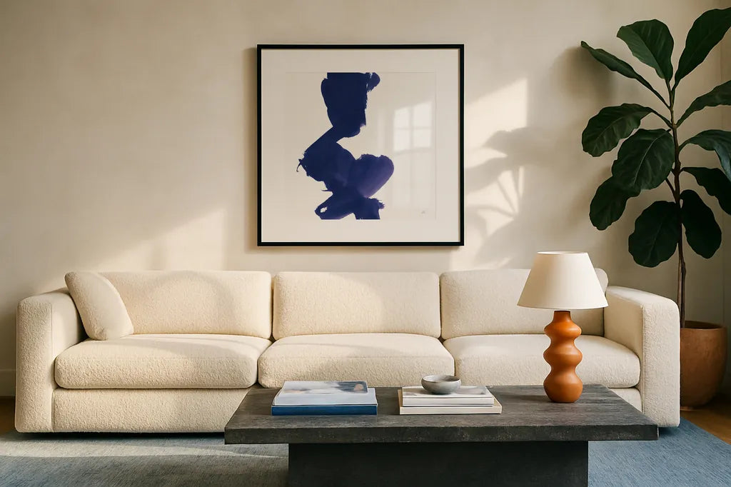 Swash II Indigo by Chris Paschke. Displayed in a glass frame with matte in a clean modern living room. Available as an archival giclee rolled canvas, fine art paper, or poster print. SKU 68773a.