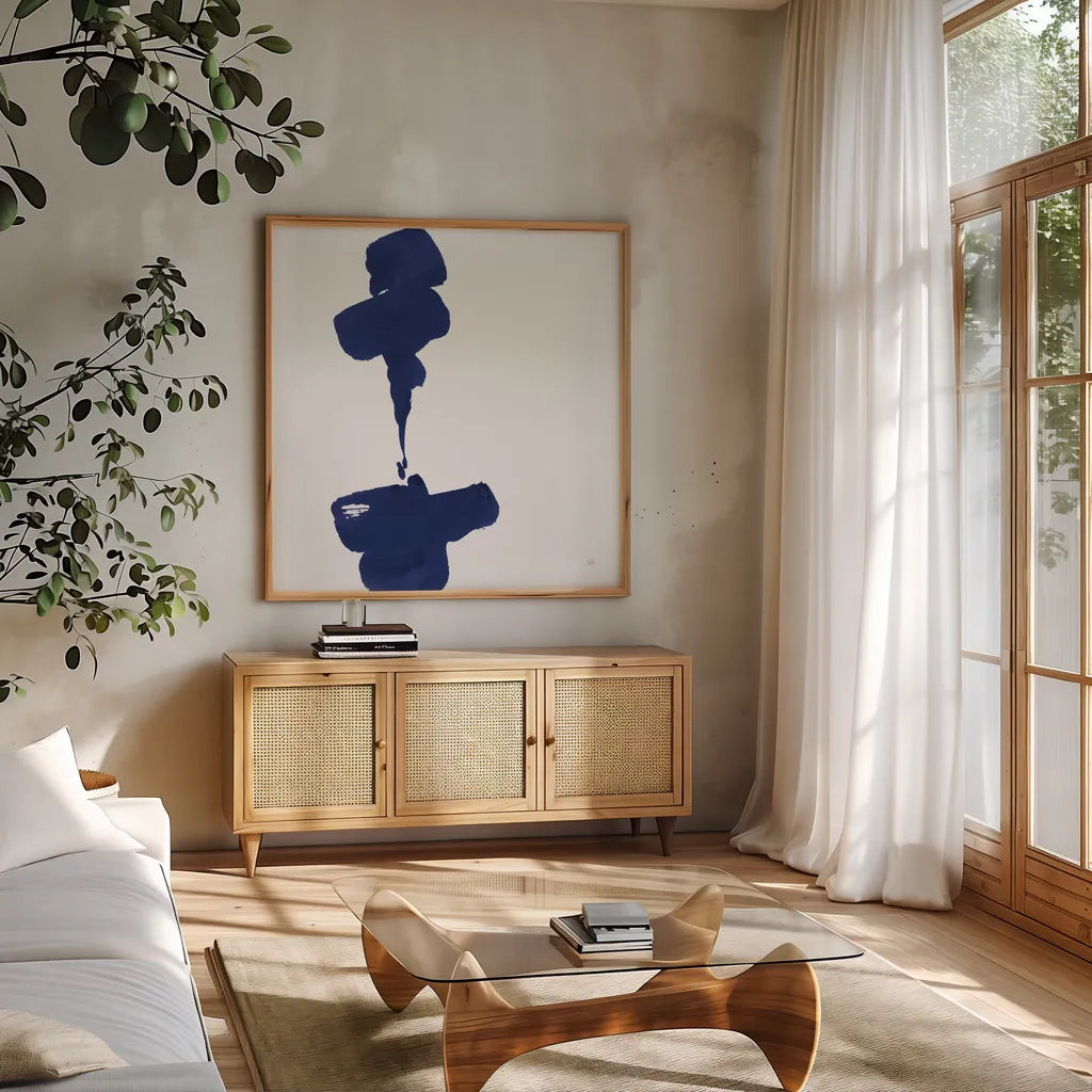 Swash III Indigo by Chris Paschke. Shown in a natural wood frame in a cozy modern living room. Available as an archival giclee rolled canvas, fine art paper, or poster print. SKU 68774a.