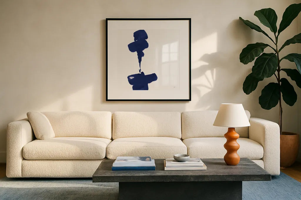 Swash III Indigo by Chris Paschke. Displayed in a glass frame with matte in a clean modern living room. Available as an archival giclee rolled canvas, fine art paper, or poster print. SKU 68774a.