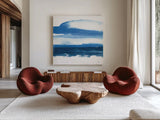 Teal and Navy II by Chris Paschke. Shown as extra-large giant wall art in a modern living room. Available as an archival giclee rolled canvas, fine art paper, or poster print. SKU 81050a.