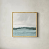 Tranquil Silver Sea II by Chris Paschke. Shown in a natural wood glass frame for a timeless modern aesthetic. Available as an archival giclee rolled canvas, fine art paper, or poster print. SKU 85289a.