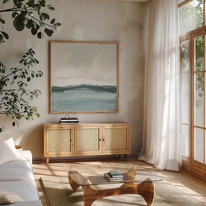 Tranquil Silver Sea II by Chris Paschke. Shown in a natural wood frame in a cozy modern living room. Available as an archival giclee rolled canvas, fine art paper, or poster print. SKU 85289a.