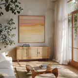 Turmeric and Sand II by Chris Paschke. Shown in a natural wood frame in a cozy modern living room. Available as an archival giclee rolled canvas, fine art paper, or poster print. SKU 68154a.