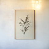 Vintage Line Lily of the Valley I by Chris Paschke. shown as a paper print in a natural frame. Available as a archival giclee rolled canvas, fine art paper, or poster print. SKU 78813h.