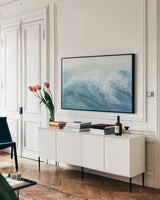Waves I by Chris Paschke. shown as a framed stretched canvas in a living room above a console. Available as a archival giclee rolled canvas, fine art paper, or poster print. SKU 61463i.