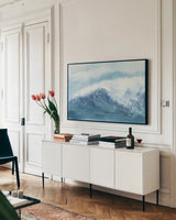 Waves III by Chris Paschke. shown as a framed stretched canvas in a living room above a console. Available as a archival giclee rolled canvas, fine art paper, or poster print. SKU 61465i.