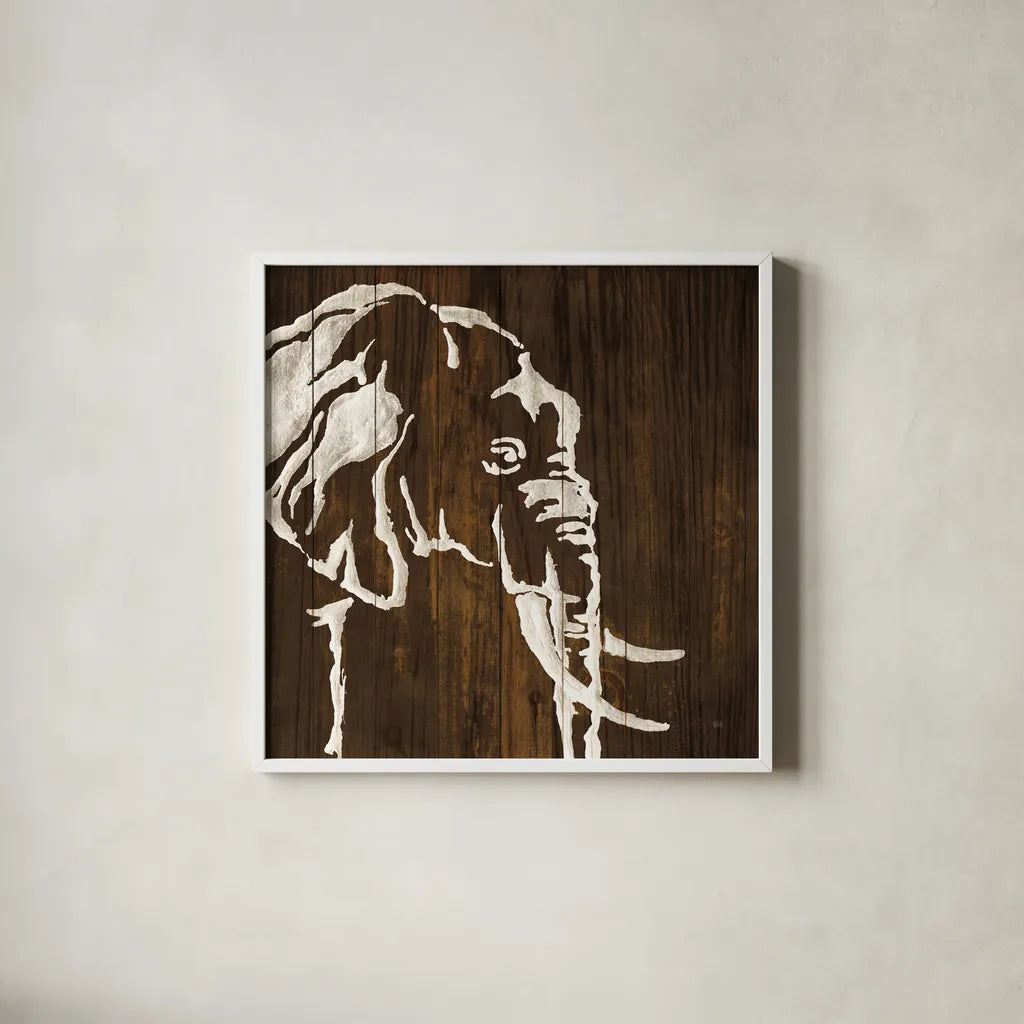 White Elephant on Dark Wood by Chris Paschke. Shown in a crisp white glass frame for a clean and minimalist style. Available as an archival giclee rolled canvas, fine art paper, or poster print. SKU 50036a.