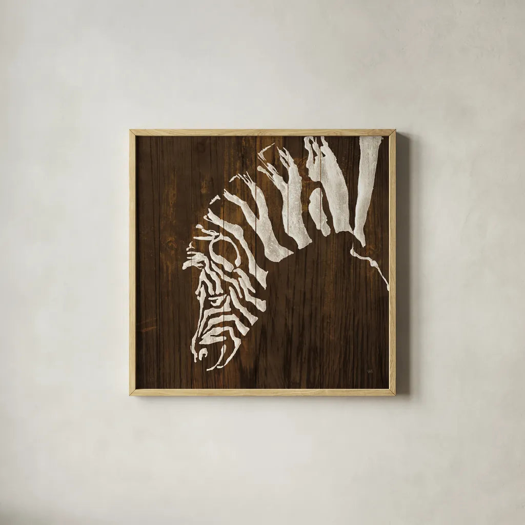 White Zebra on Dark Wood by Chris Paschke. Shown in a natural wood glass frame for a timeless modern aesthetic. Available as an archival giclee rolled canvas, fine art paper, or poster print. SKU 50039a.