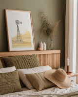 Windmill Landscape III by Chris Paschke. shown as a paper print in a natural frame. Available as a archival giclee rolled canvas, fine art paper, or poster print. SKU 76900h.