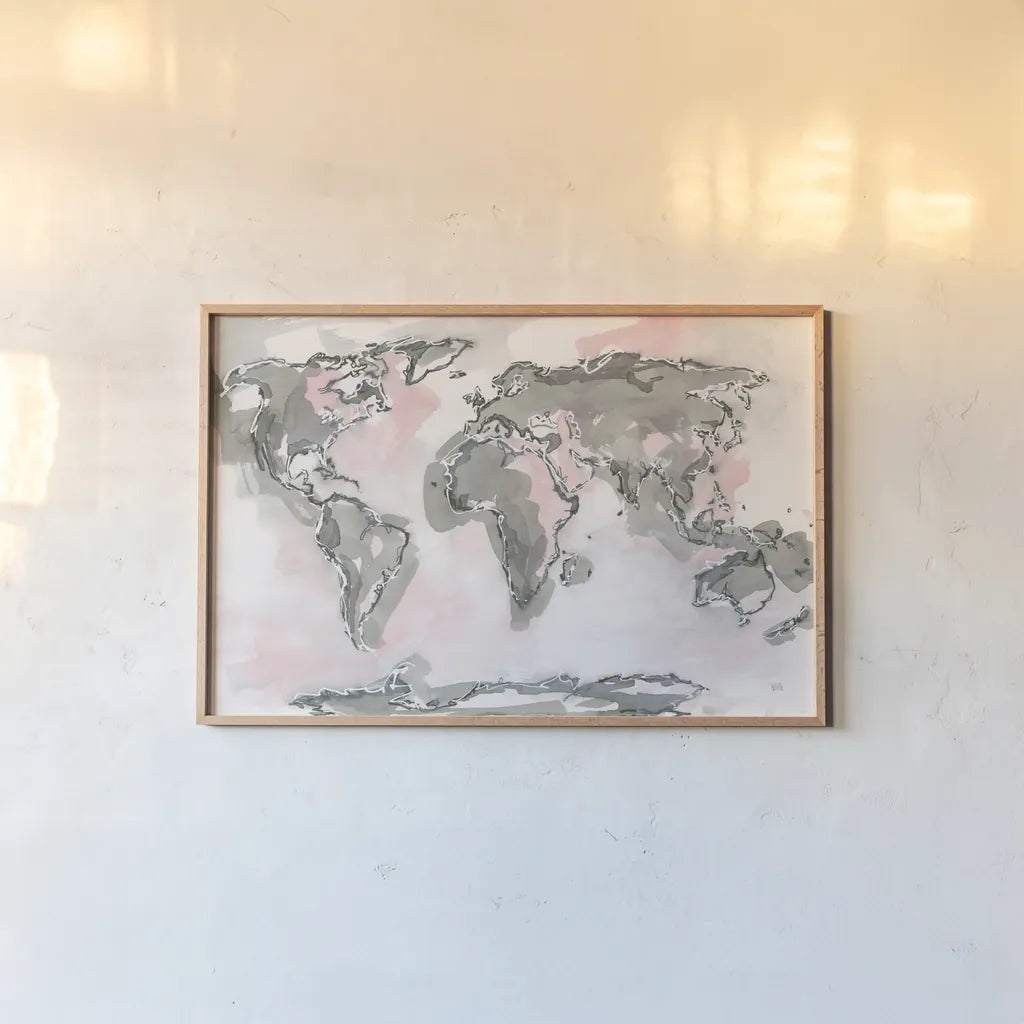 World Map Blush by Chris Paschke. shown as a paper print in a natural frame. Available as a archival giclee rolled canvas, fine art paper, or poster print. SKU 53227i.
