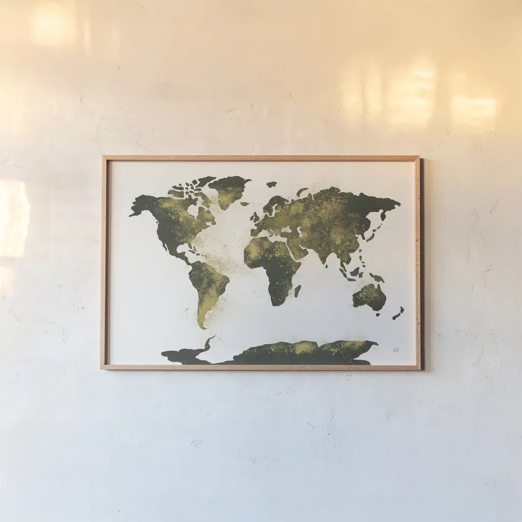 World Map Gold Dust by Chris Paschke. shown as a paper print in a natural frame. Available as a archival giclee rolled canvas, fine art paper, or poster print. SKU 53224i.