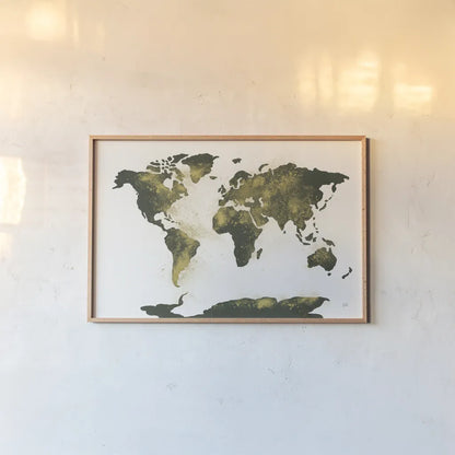World Map Gold Dust by Chris Paschke. shown as a paper print in a natural frame. Available as a archival giclee rolled canvas, fine art paper, or poster print. SKU 53224i.