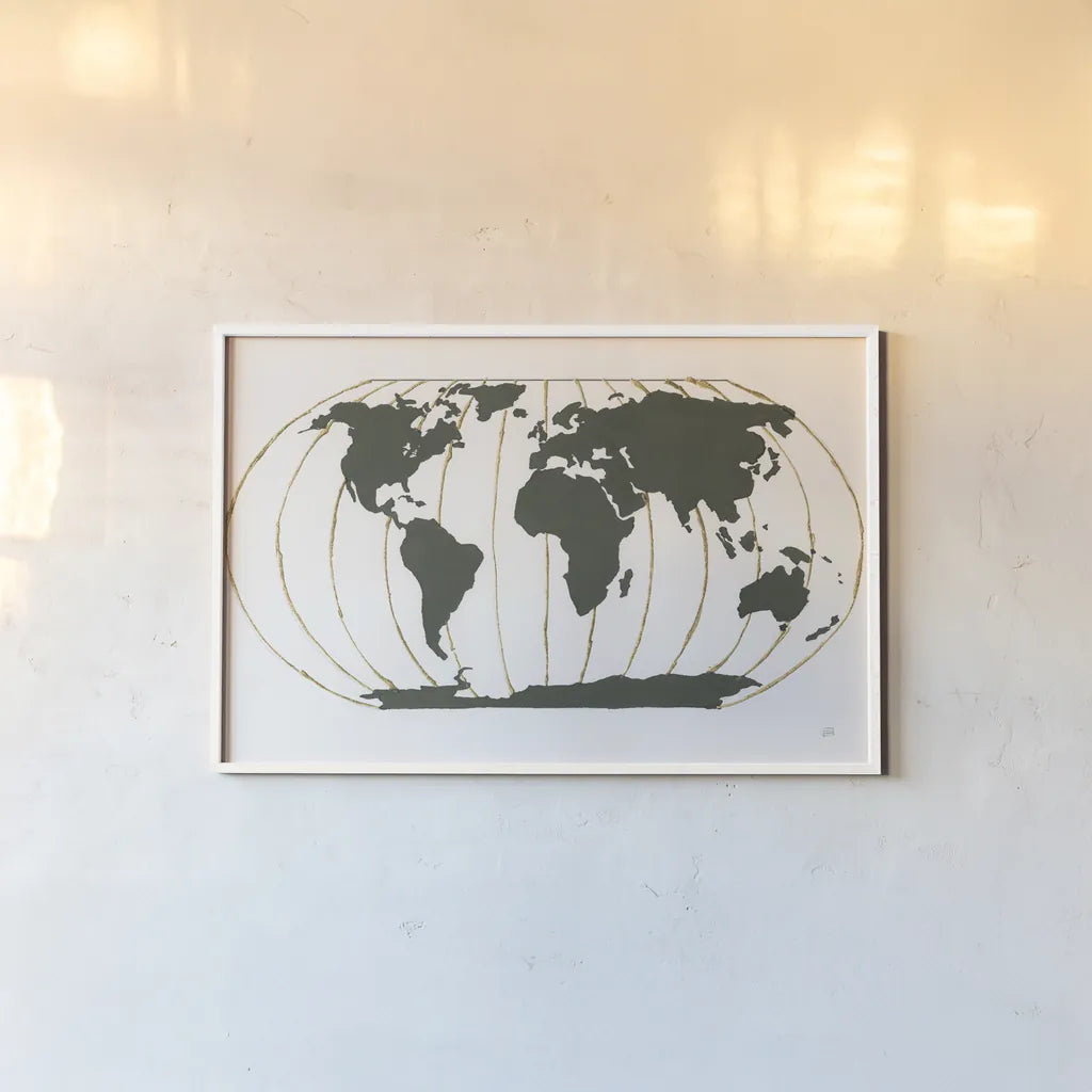World Map Gold Lines by Chris Paschke. shown as a paper print in a white frame. Available as a archival giclee rolled canvas, fine art paper, or poster print. SKU 53223i.