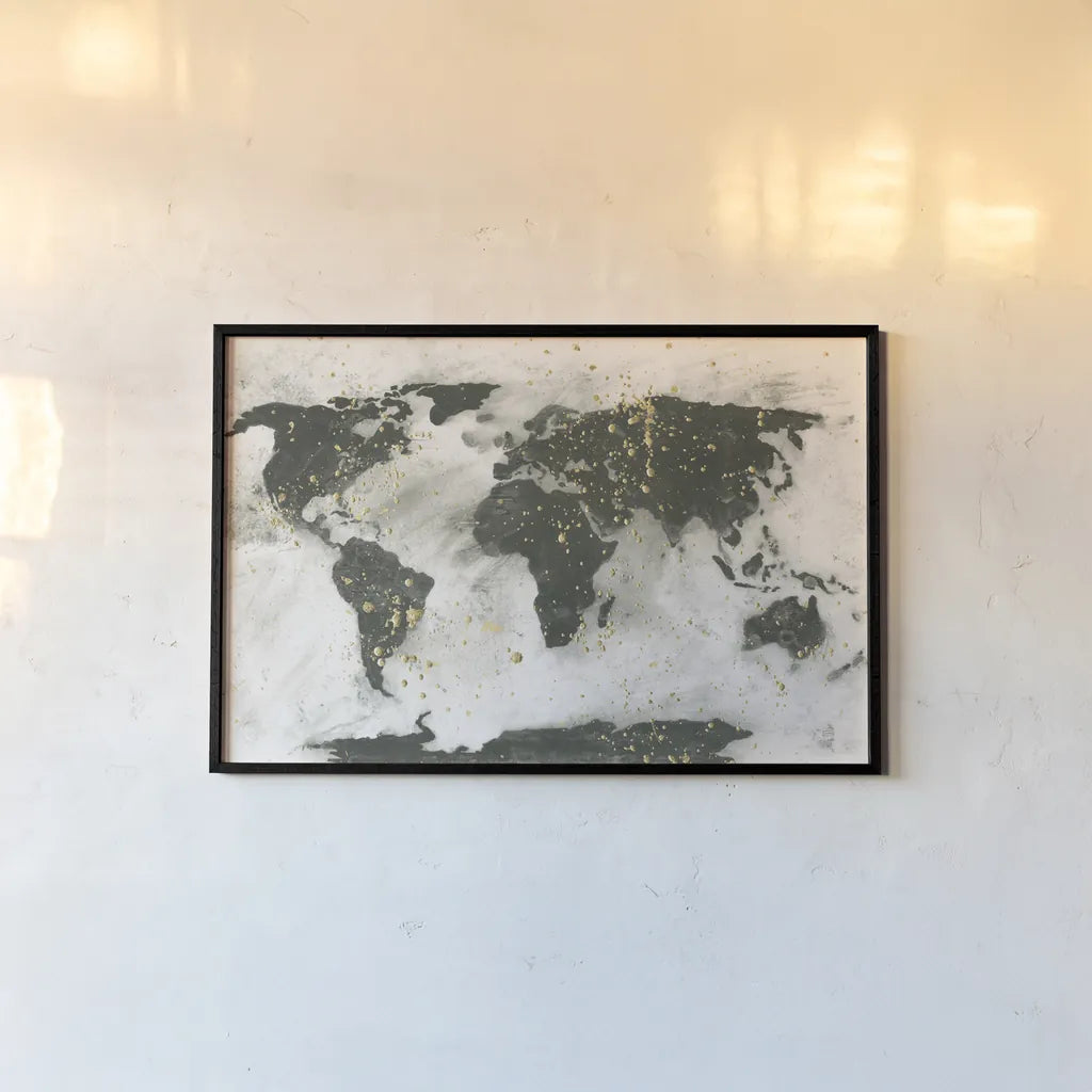 World Map Gold Speckle by Chris Paschke. shown as a paper print in a black flame. Available as a archival giclee rolled canvas, fine art paper, or poster print. SKU 53226i.