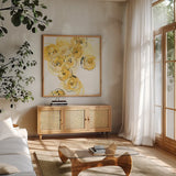 Yellow Roses Anew I by Chris Paschke. Shown in a natural wood frame in a cozy modern living room. Available as an archival giclee rolled canvas, fine art paper, or poster print. SKU 22562a.