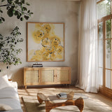 Yellow Roses Anew II by Chris Paschke. Shown in a natural wood frame in a cozy modern living room. Available as an archival giclee rolled canvas, fine art paper, or poster print. SKU 22563a.