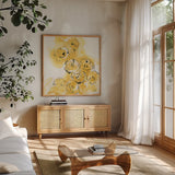 Yellow Roses Anew II v.2 by Chris Paschke. Shown in a natural wood frame in a cozy modern living room. Available as an archival giclee rolled canvas, fine art paper, or poster print. SKU 22565a.