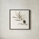 Zen Cranes II Warm by Chris Paschke. Shown in a sleek black glass frame for a contemporary gallery look. Available as an archival giclee rolled canvas, fine art paper, or poster print. SKU 51745a.