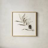 Zen Cranes II Warm by Chris Paschke. Shown in a natural wood glass frame for a timeless modern aesthetic. Available as an archival giclee rolled canvas, fine art paper, or poster print. SKU 51745a.