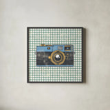 Wanderlust Capture the World No Words by Cleonique Hilsaca. Shown in a sleek black glass frame for a contemporary gallery look. Available as an archival giclee rolled canvas, fine art paper, or poster print. SKU 60990a.