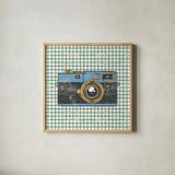 Wanderlust Capture the World No Words by Cleonique Hilsaca. Shown in a natural wood glass frame for a timeless modern aesthetic. Available as an archival giclee rolled canvas, fine art paper, or poster print. SKU 60990a.