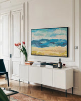 Abstract Coastal I by Courtney Prahl. shown as a framed stretched canvas in a living room above a console. Available as a archival giclee rolled canvas, fine art paper, or poster print. SKU 44177i.