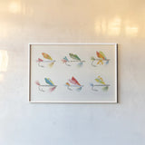 Angling in the Stream Lures II by Courtney Prahl. shown as a paper print in a white frame. Available as a archival giclee rolled canvas, fine art paper, or poster print. SKU 73255i.