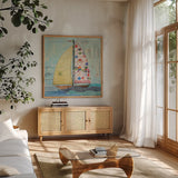 At the Regatta I Sail Sq by Courtney Prahl. Shown in a natural wood frame in a cozy modern living room. Available as an archival giclee rolled canvas, fine art paper, or poster print. SKU 29777a.