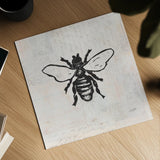 Bee Stamp BW by Courtney Prahl. Shown as a detailed flat fine art print, highlighting archival giclee quality. Available as an archival giclee rolled canvas, fine art paper, or poster print. SKU 54278a.