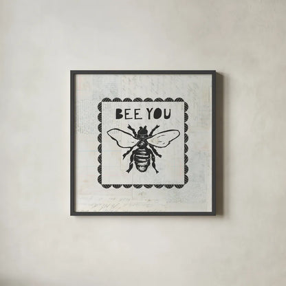 Bee Stamp Bee You by Courtney Prahl. Shown in a sleek black glass frame for a contemporary gallery look. Available as an archival giclee rolled canvas, fine art paper, or poster print. SKU 44528a.