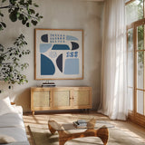 Cozy Cottage II Sq by Courtney Prahl. Shown in a natural wood frame in a cozy modern living room. Available as an archival giclee rolled canvas, fine art paper, or poster print. SKU 67310a.