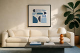 Cozy Cottage II Sq by Courtney Prahl. Displayed in a glass frame with matte in a clean modern living room. Available as an archival giclee rolled canvas, fine art paper, or poster print. SKU 67310a.