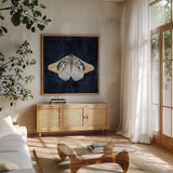 Elegant Moth II by Courtney Prahl. Shown in a natural wood frame in a cozy modern living room. Available as an archival giclee rolled canvas, fine art paper, or poster print. SKU 103148a.