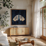 Elegant Moth III by Courtney Prahl. Shown in a natural wood frame in a cozy modern living room. Available as an archival giclee rolled canvas, fine art paper, or poster print. SKU 103149a.