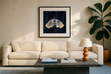 Elegant Moth III by Courtney Prahl. Displayed in a glass frame with matte in a clean modern living room. Available as an archival giclee rolled canvas, fine art paper, or poster print. SKU 103149a.